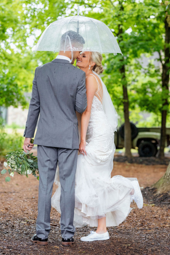 Couple in rain at wedding